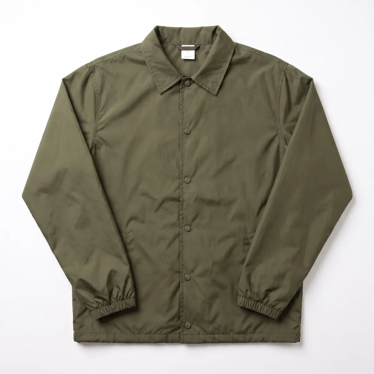 Olive nylon coach jacket shown blank, then with a cream HALVERN ROWING print. The mark is a fictional sample.