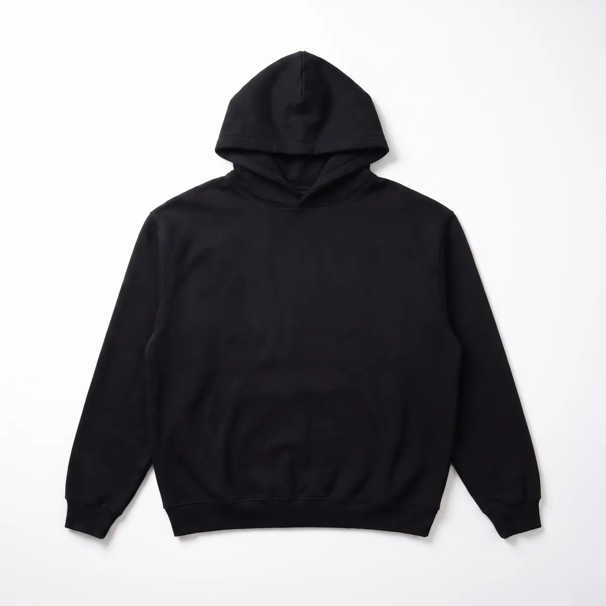 Black heavyweight hoodie shown blank, then with a white BRAXLOW puff print. The mark is a fictional sample.
