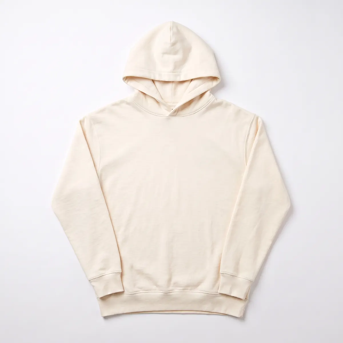 Cream fleece pullover hoodie shown blank, then with a green embroidered TESSARO COFFEE CO. logo. The mark is a fictional sample.