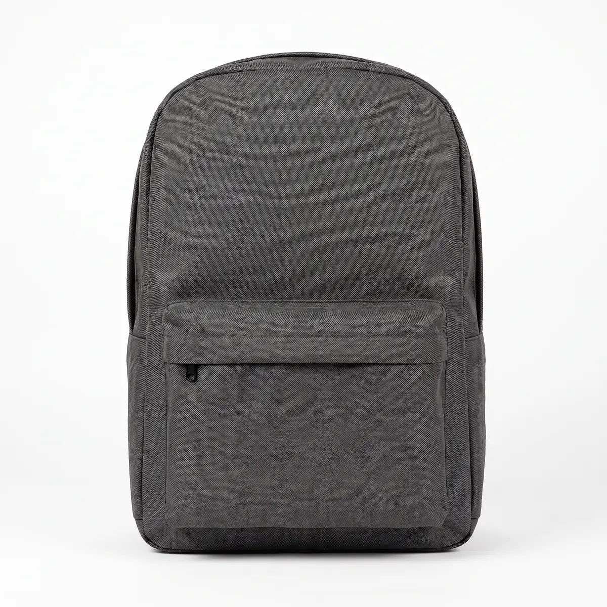 Charcoal laptop backpack shown blank, then with a black KILNSIDE mountain transfer. The mark is a fictional sample.