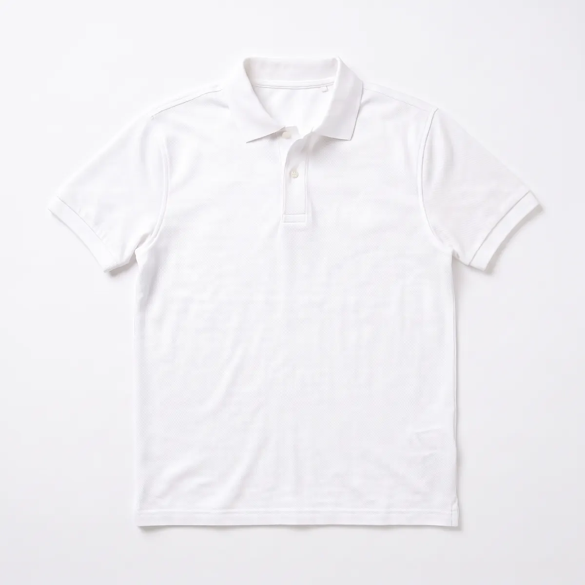 White pique polo shown blank, then with a navy embroidered QUILLBY SUPPLY logo. The mark is a fictional sample.