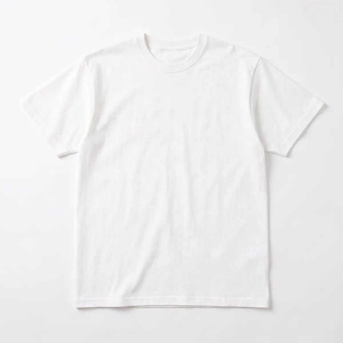 White heavyweight crew tee shown blank, then with a navy HALVERN ROWING oars print. The mark is a fictional sample.