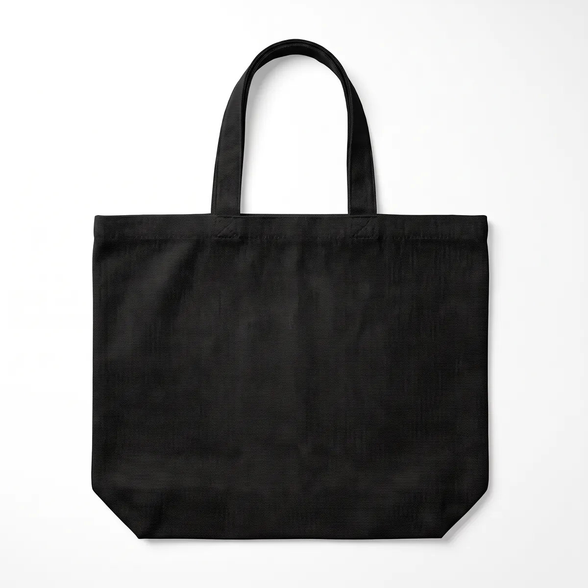 Black heavy canvas tote shown blank, then with a full-color VELLORA botanical print. The mark is a fictional sample.